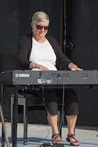 Carol Ann MacDougall playing a solo on keyboard