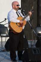 JP MacNeil singing The Water is Wide to his own guitar accompaniment