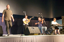 John Pellerin step dancing to the music of Howie MacDonald on fiddle, Cathy Hawley on keyboard, and Mary Beth Carty on guitar