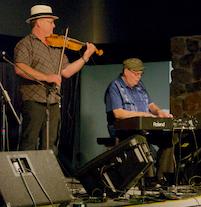 Kyle MacNeil on fiddle and Doug MacPhee on keyboard playing a lament