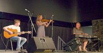 Mary Anna MacNeil on fiddle, accompanied by Sheumas MacNeil on keyboard and Malcolm MacNeil on guitar